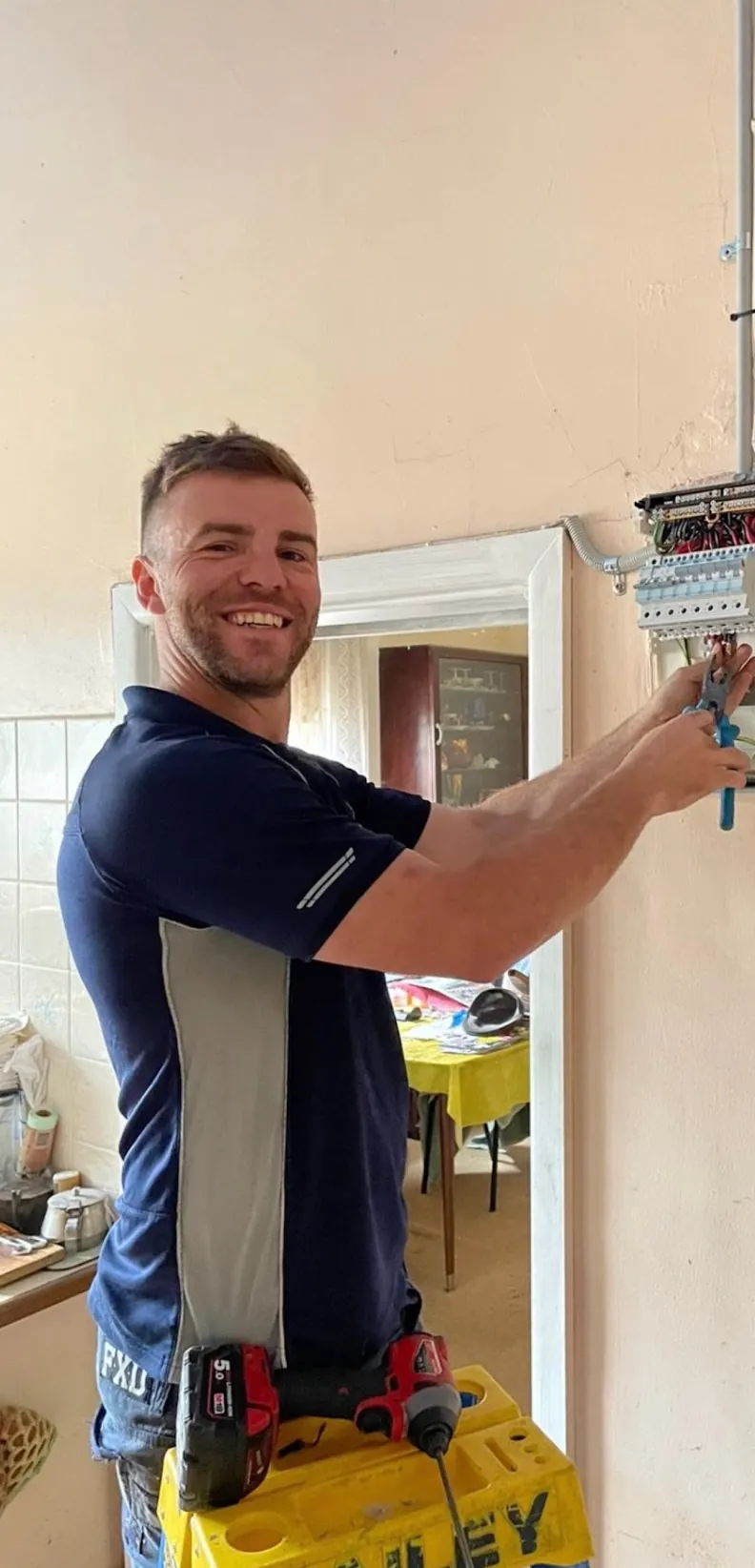 Licensed Melbourne electrician working on a residential switchboard